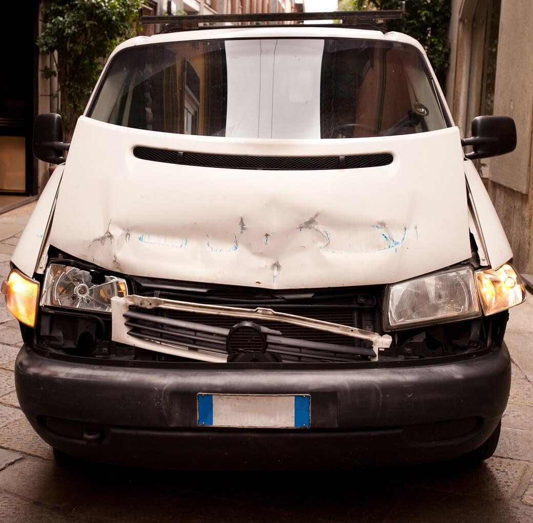 image of crashed white delivery van from the front