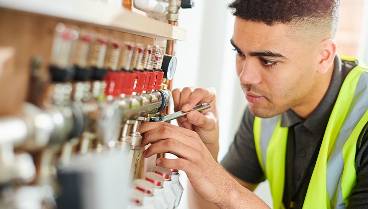 male field technician working with tools