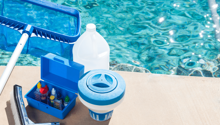 pool with net and chemicals sitting on the ground