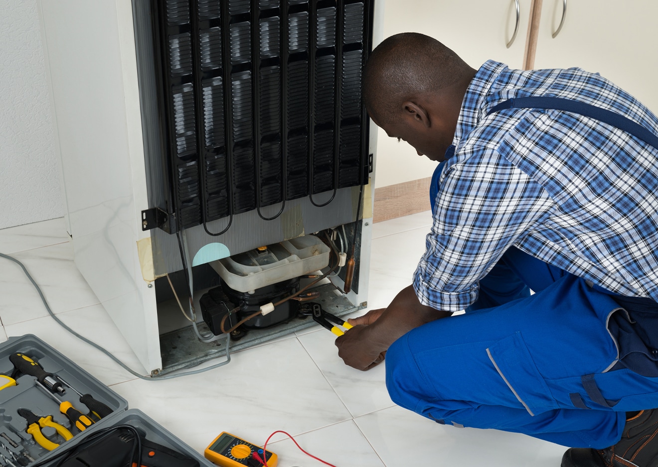 male tech working on an appliance