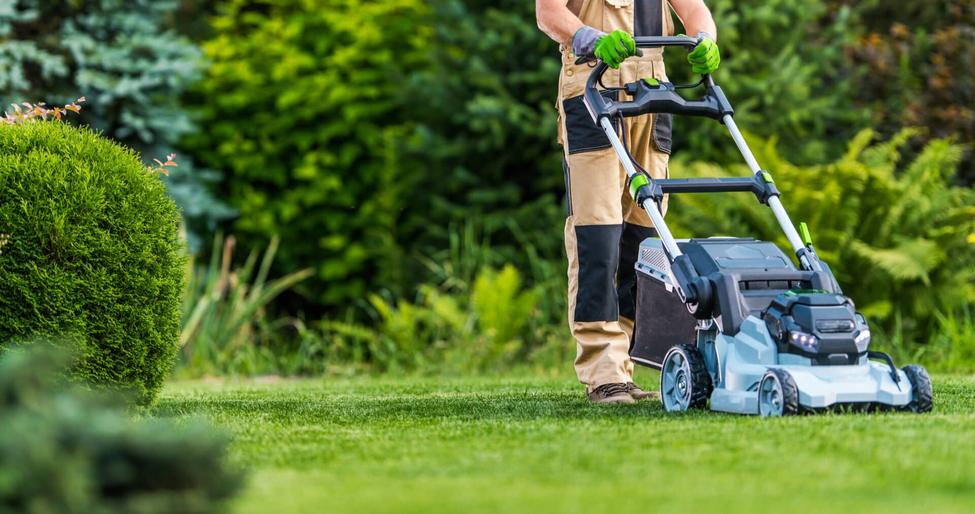 person using lawn mower